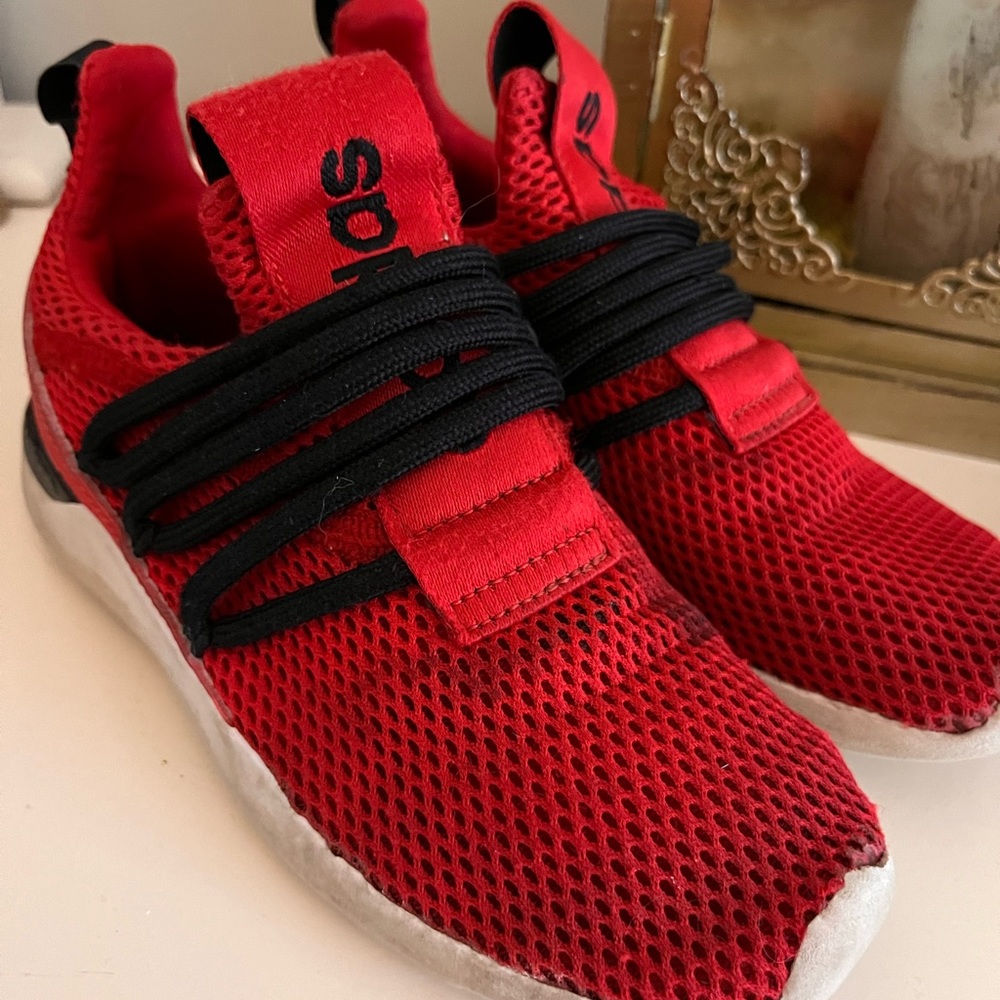 Red and black slip on adidas kid athletic shoe. Size 1